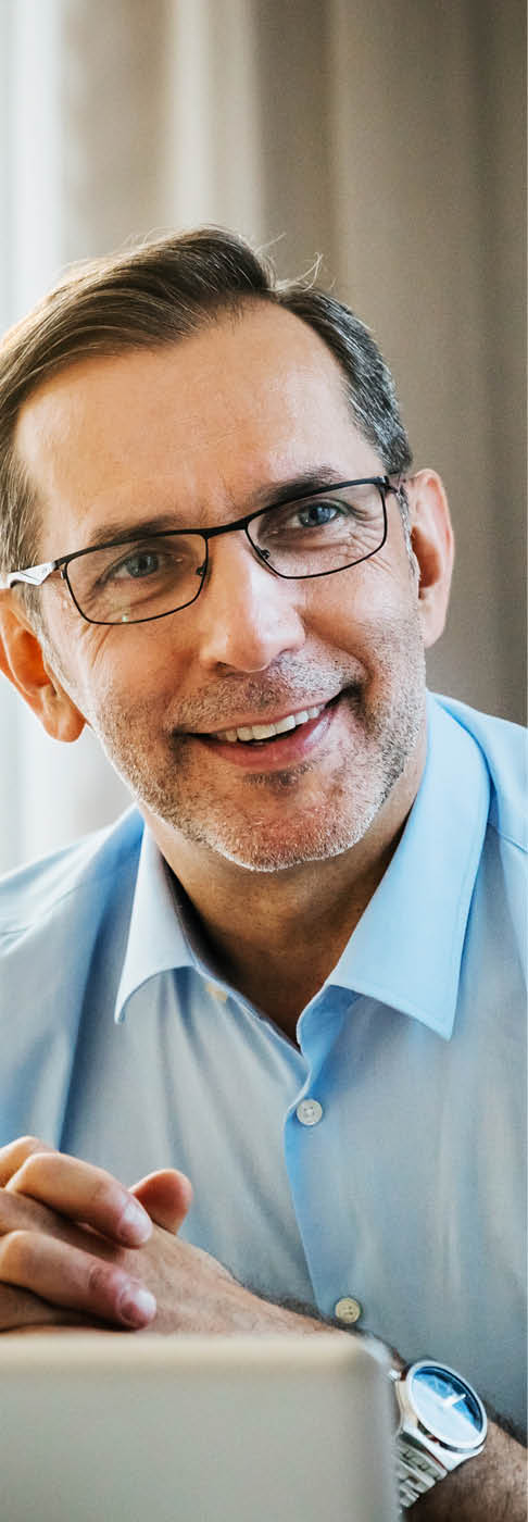 A businessman is impressed with the ideas his colleague is sharing.